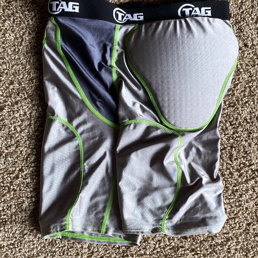 TAG football padded under guards Size M